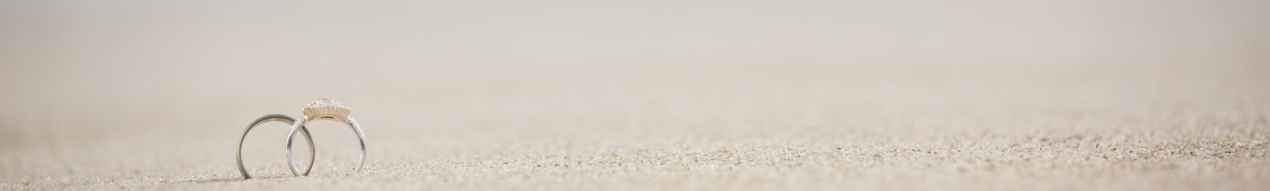 Pair of wedding ring on sand 2 wedding rings on the sand