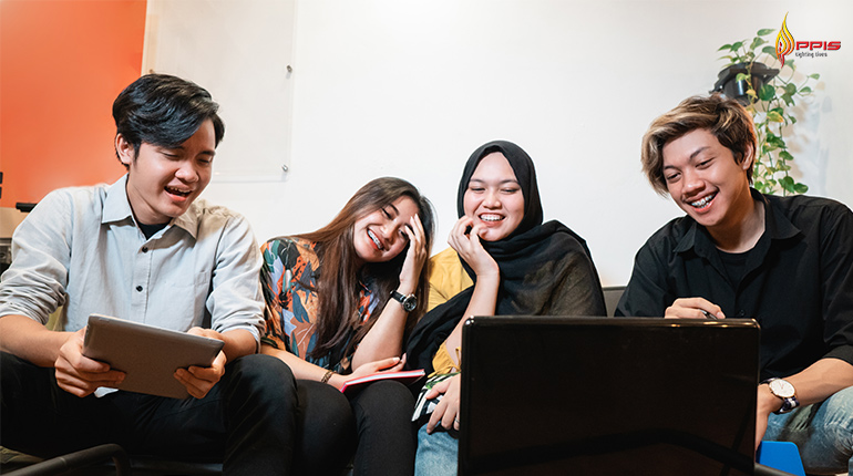 group of adults gathered together looking happy
